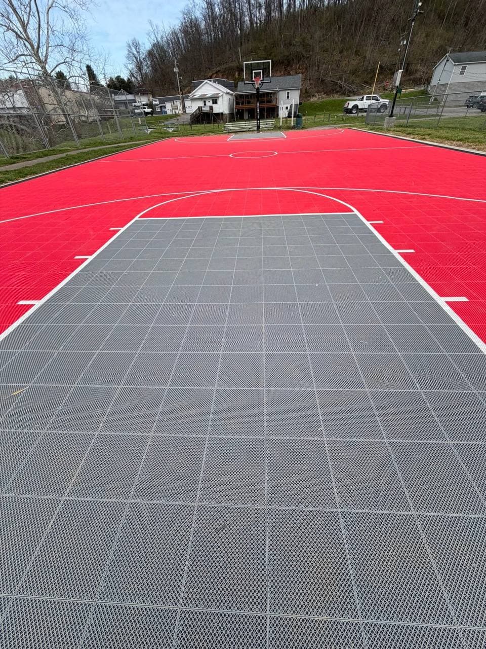 Community members shooting hoops on the restored court