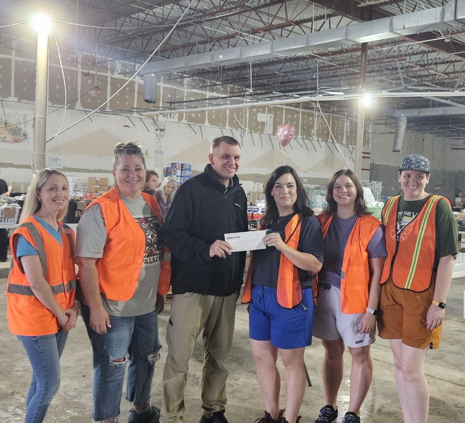 Eastern Gas presents a $25,000 flood-recovery donation to the Lewis County FRN