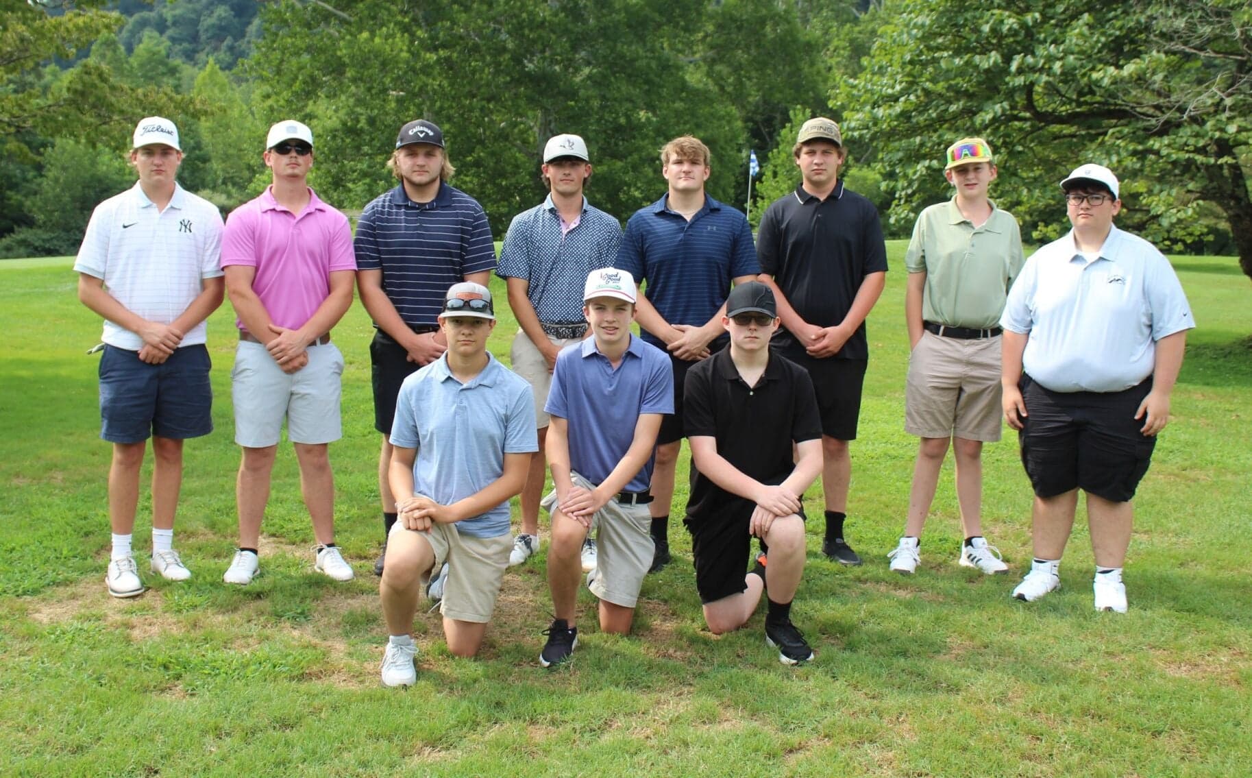 Golfers in the early-season Alpine Lake match field