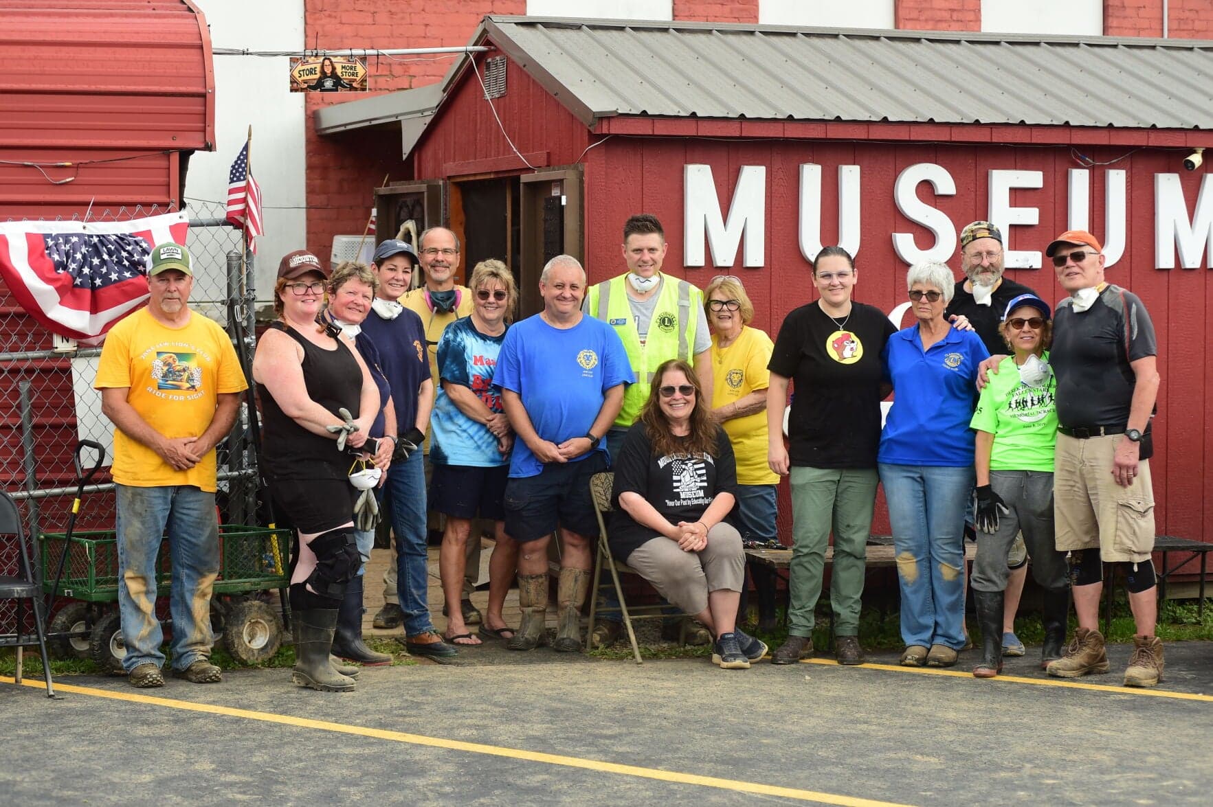 Volunteers work inside the flood-damaged Mountaineer Military Museum