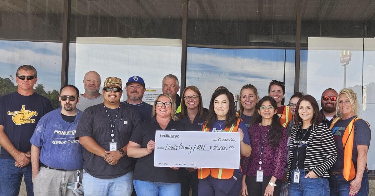 FirstEnergy representatives present a $20,000 check to the Lewis County Family Resource Network