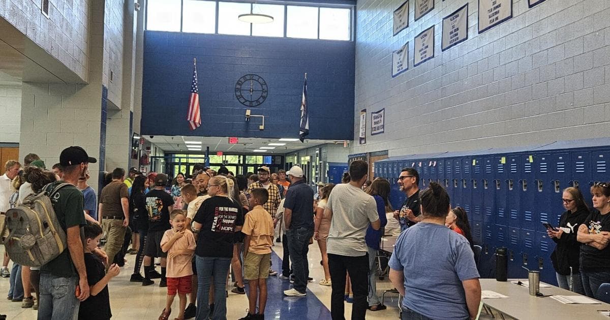 Students and parents speak with middle school teachers at the Jackson’s Mill logistics meeting