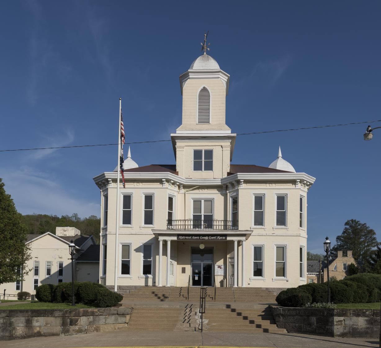 The historic Lewis County Courthouse in Weston beneath a clear blue sky