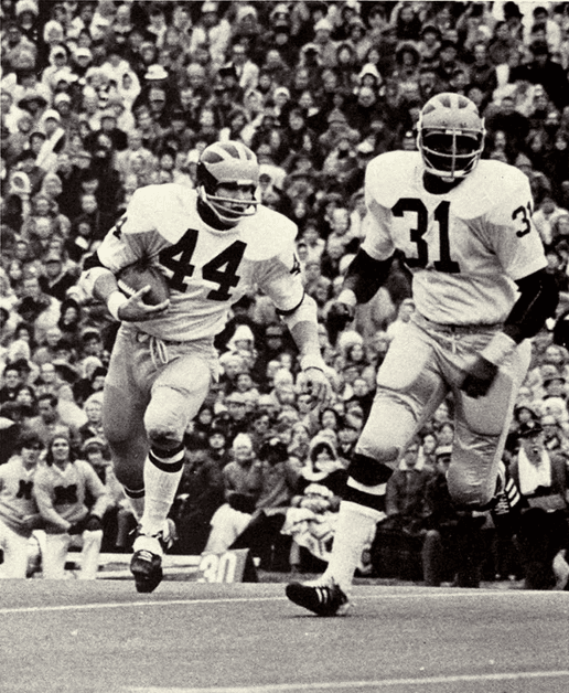 Chuck Heater carrying the football for Michigan
