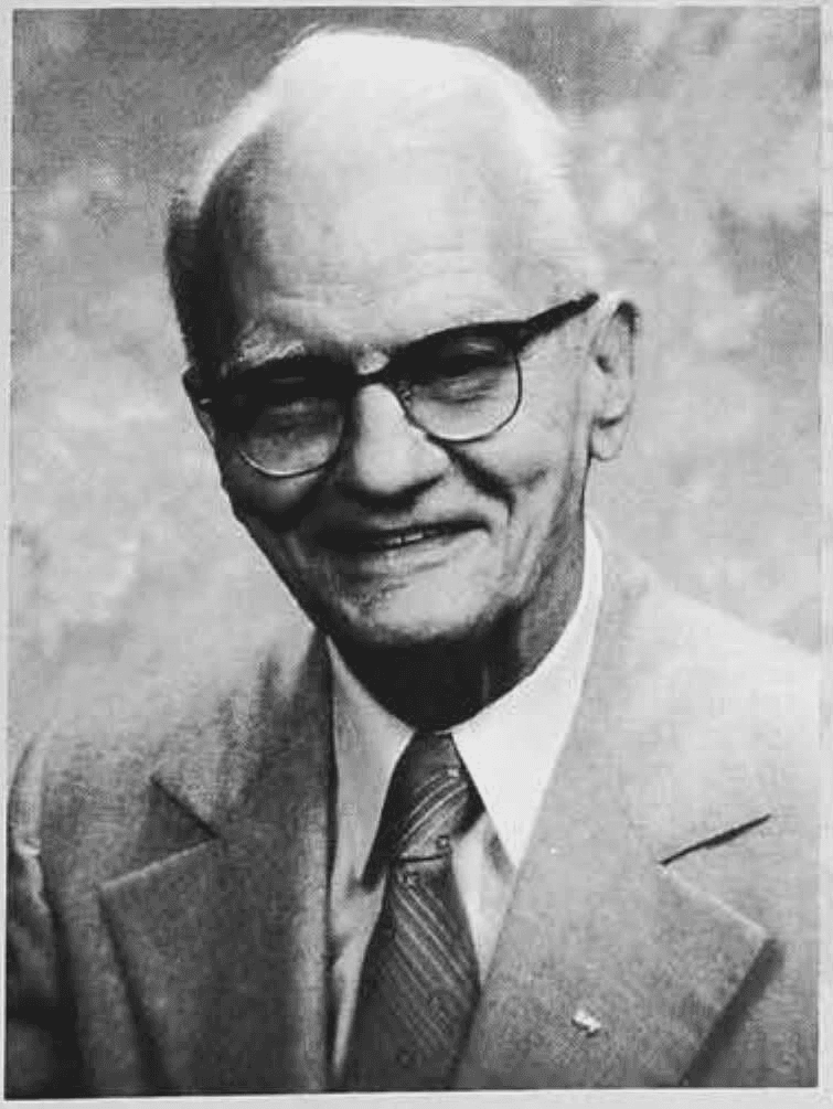 Black-and-white portrait of Robert Linn Bland Jr. wearing glasses, a suit, and a tie